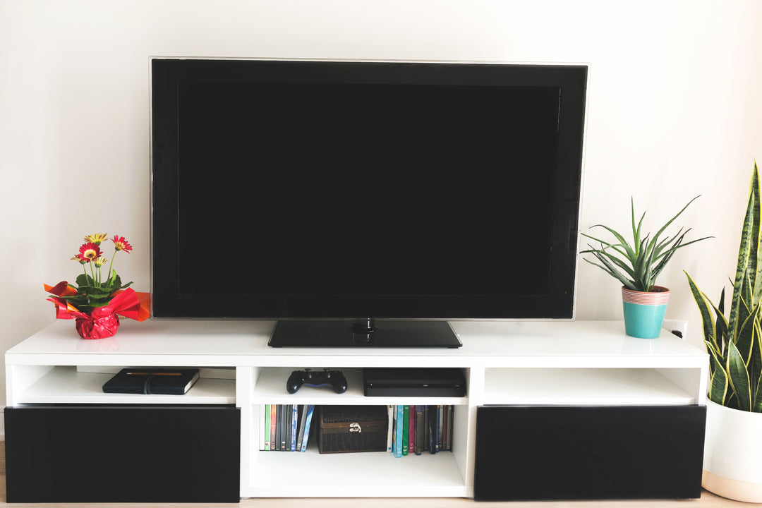 Pioneer television on home living room stand.